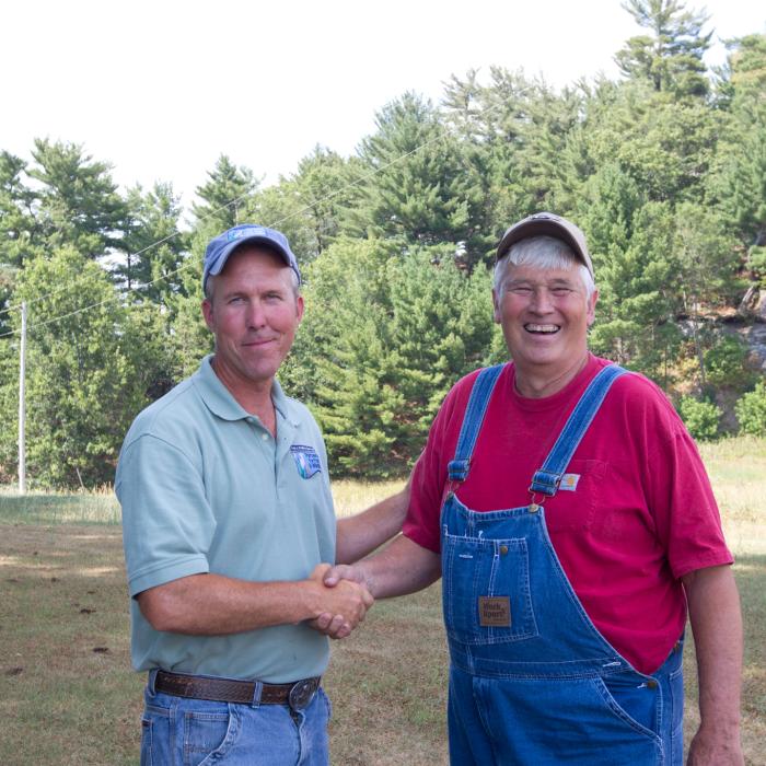 USFWS Partners for Fish and Wildlife state coordinator Kurt Waterstradt meets with landowner Steve Thompson at his completed restoration project in Wisconsin.